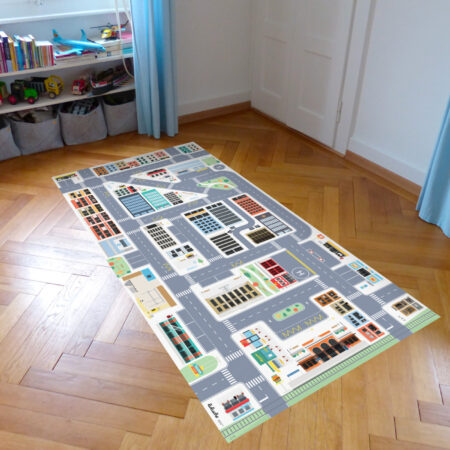 Le tapis préféré des enfants qui aiment jouer aux petites voitures avec une ville et des routes